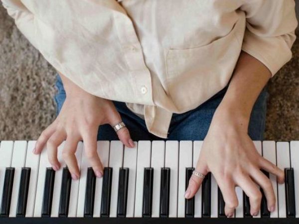 Person playing music on a keyboard